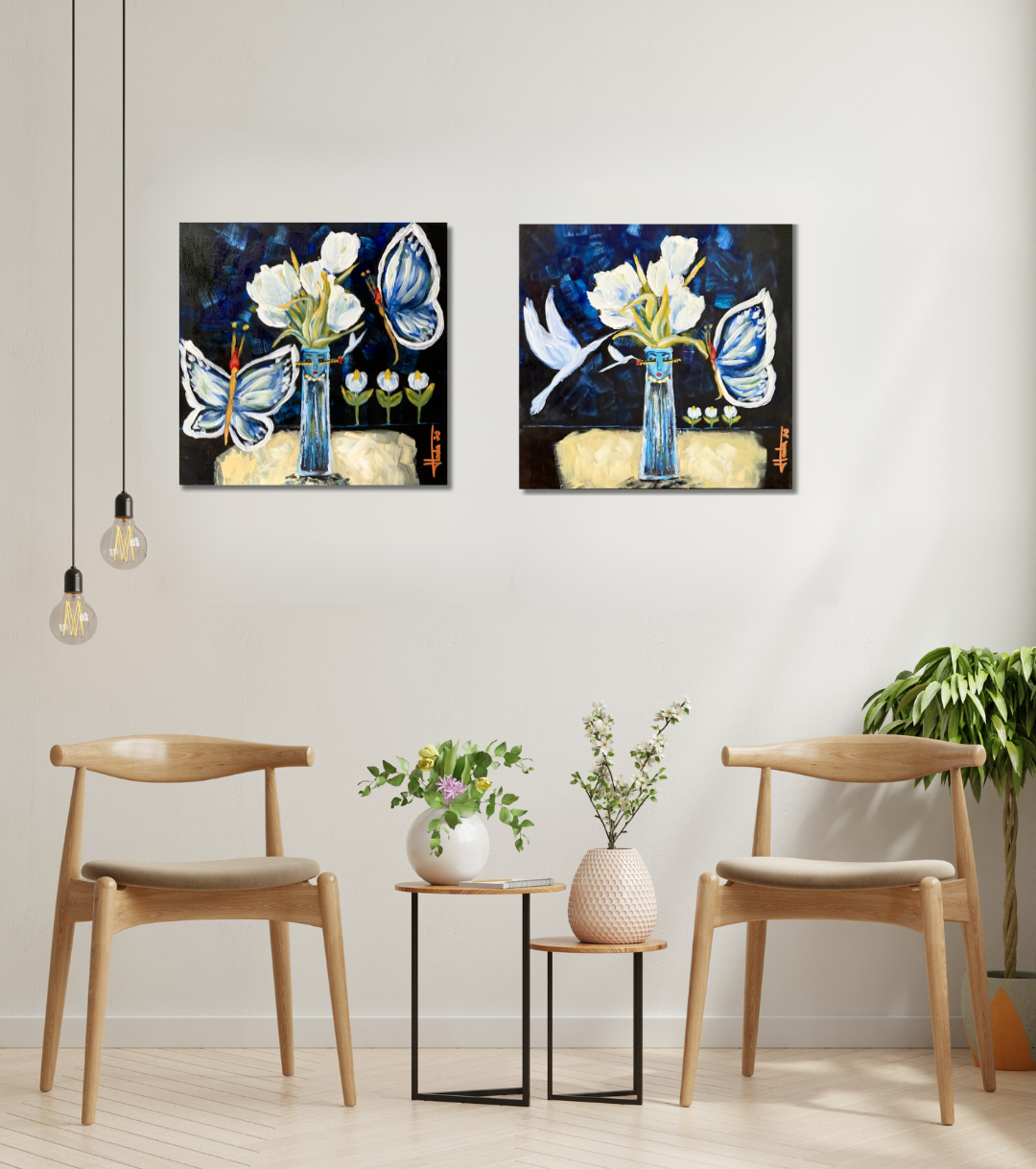 Two abstract paintings of flowers and butterflies on a wall above two wooden chairs.