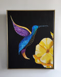 Framed artwork of a blue bird and yellow flower on a black background